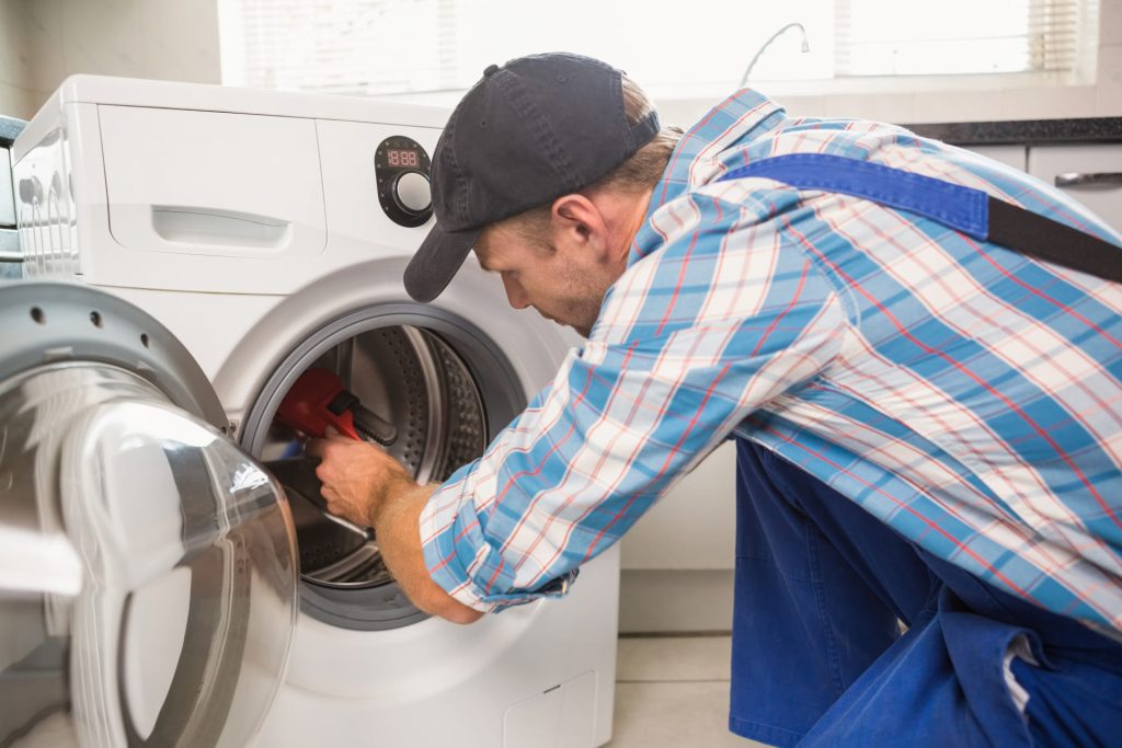 handyman-fixing-washing-machine-2